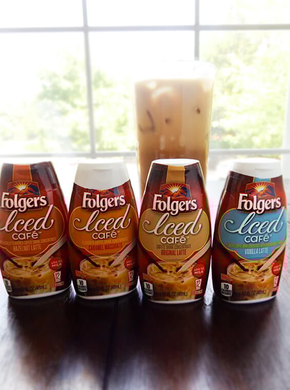 Folgers coffee concentrates and an iced coffee drink in the background.