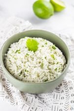This easy cilantro lime rice recipe will feed your chipotle cravings, without having to leave home! This easy side dish is the perfect addition to a homemade burrito bowl or any other simple meal requiring an extra kick of flavor.