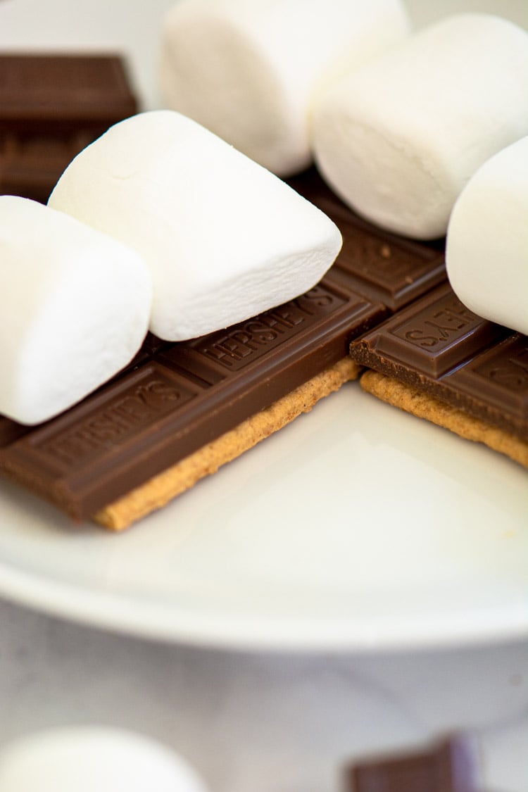Two Marshmallows on each graham cracker and chocolate.