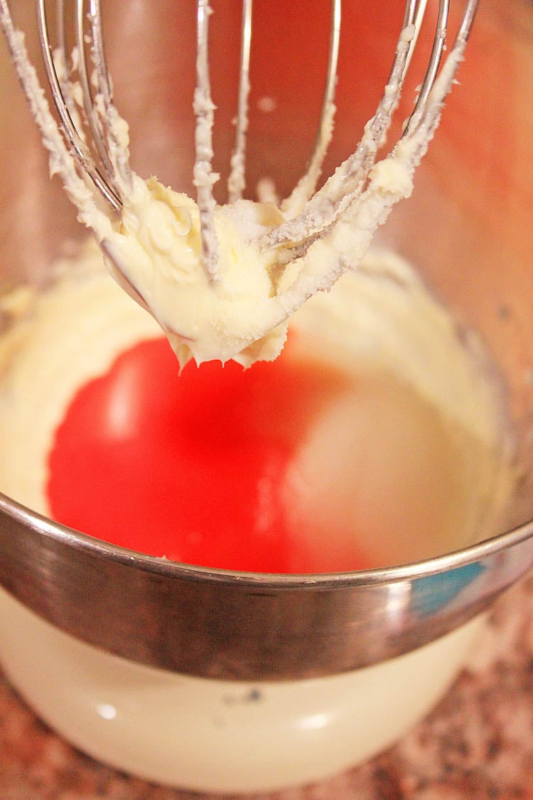 Batter with maraschino cherry juice to give it the flavor an pink coloring in the mixing bowl.
