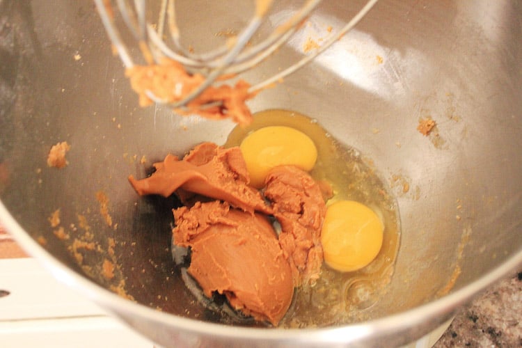 peanut butter and eggs in a mixing bowl.