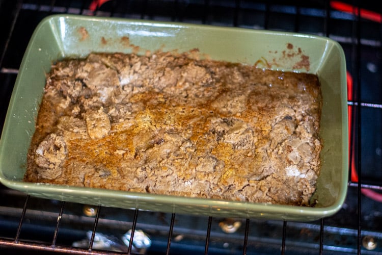 green cake pan with the apple pie spiced dump cake in the oven.