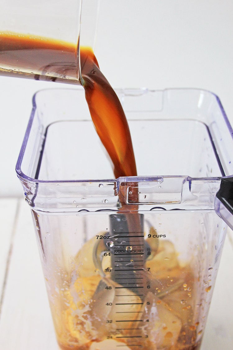 pouring coffee into the blender with ice cream.