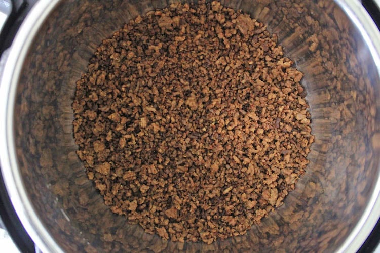 Top view photo of Instant Pot showing the browned and drained ground beef.