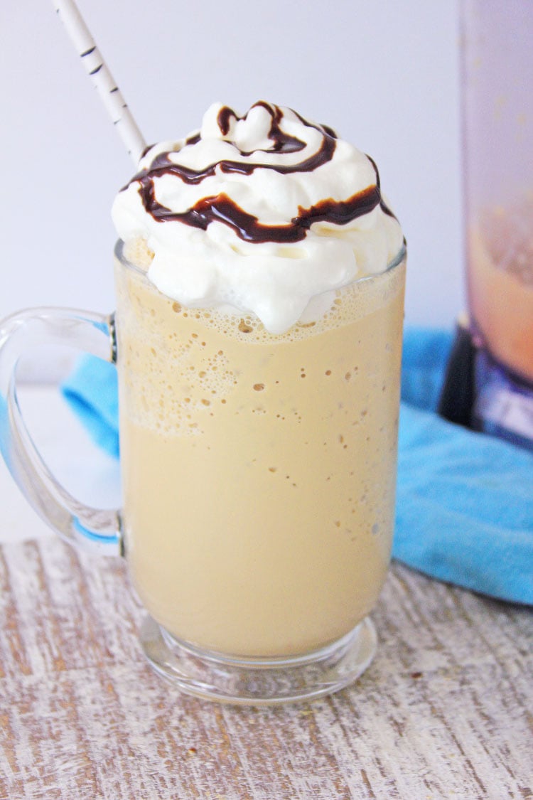 frappe topped with whipped cream and chocolate sauce swirl.