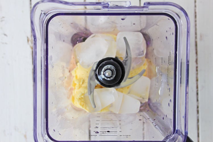 top down view of blender with ice and ice cream.