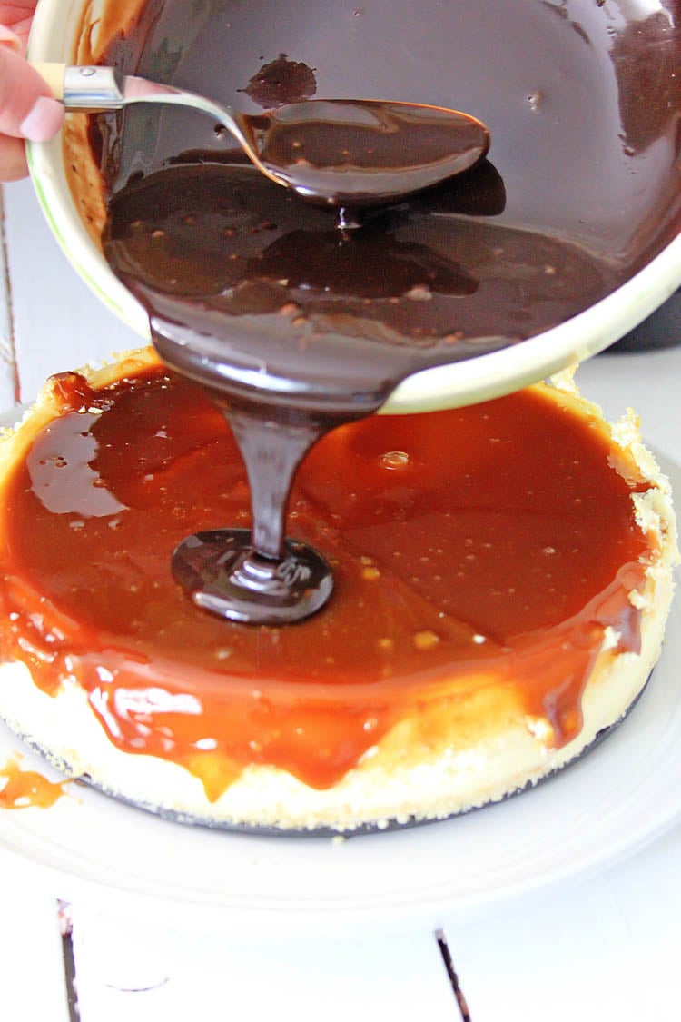 Pouring the chocolate ganache on the Twix air fryer cheesecake.