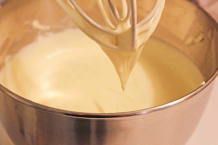 mixing the cheesecake batter in a stand mixer.