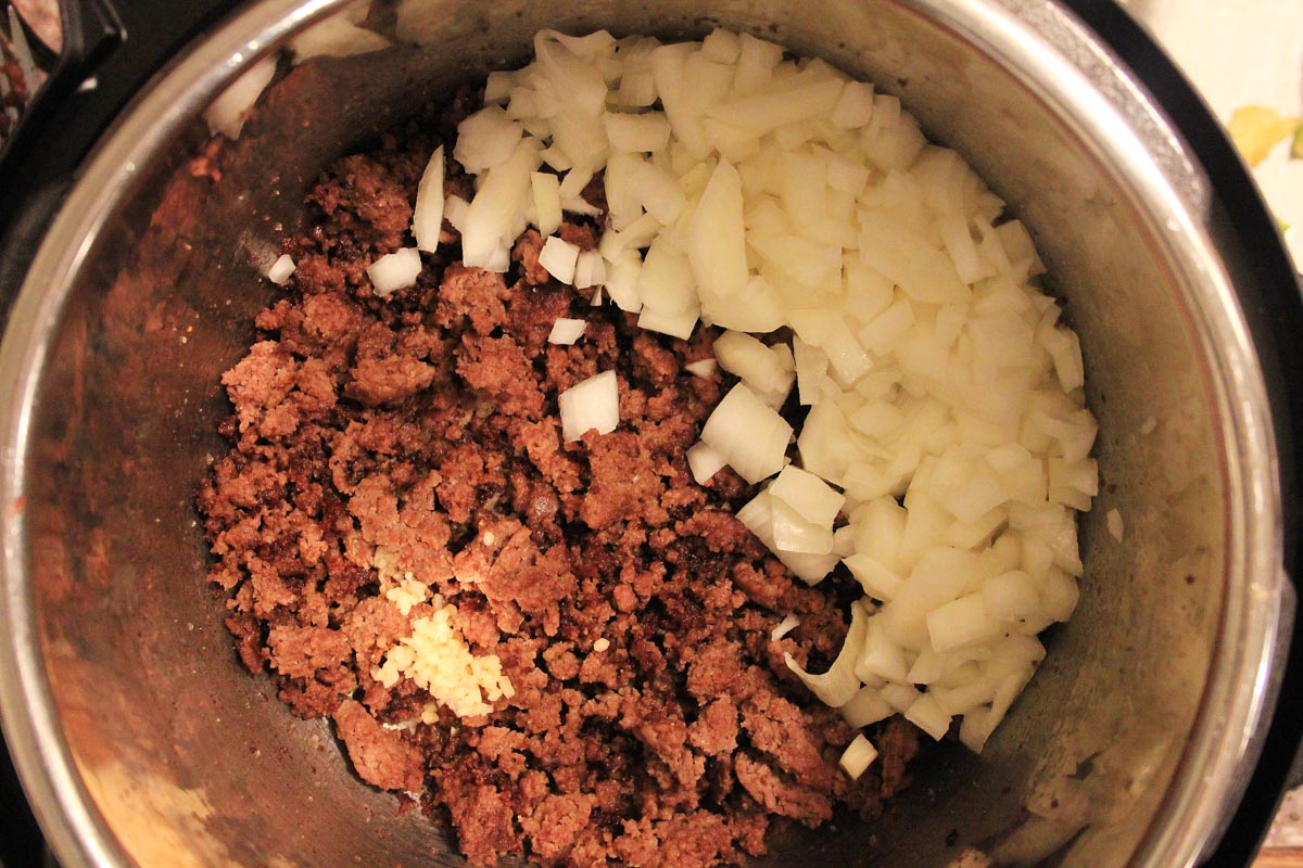 add the onions to the instant pot after the beef is browned.