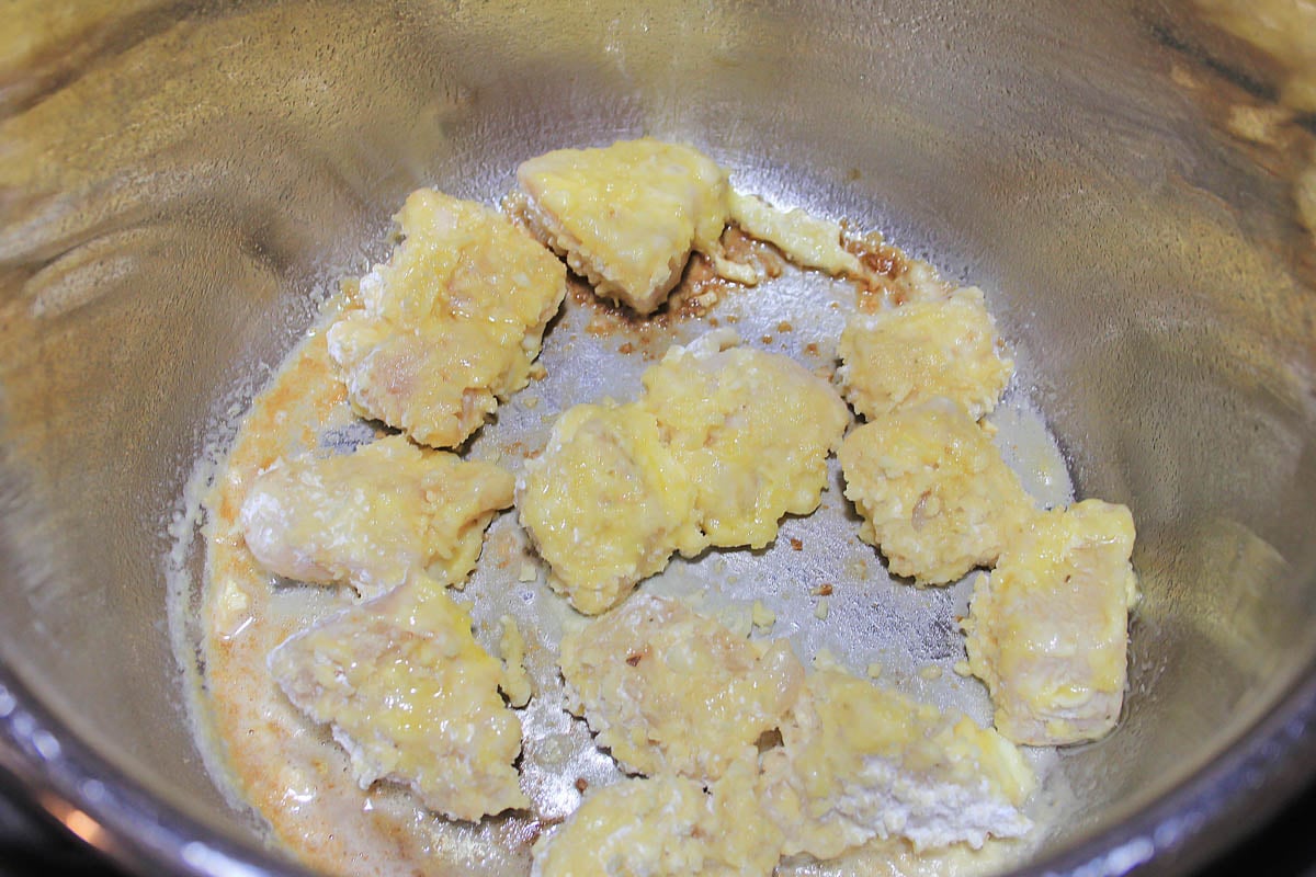 Sauté the chicken in the bottom of the instant pot until it is crispy.