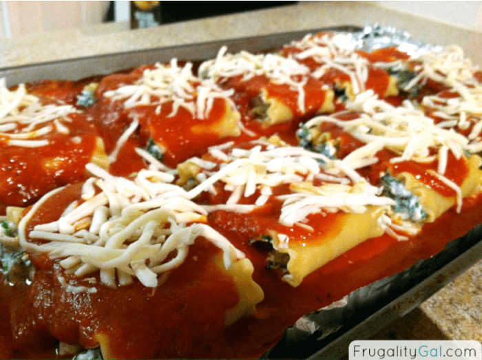 topping the spinach lasagna roll-ups with mozzarella cheese.
