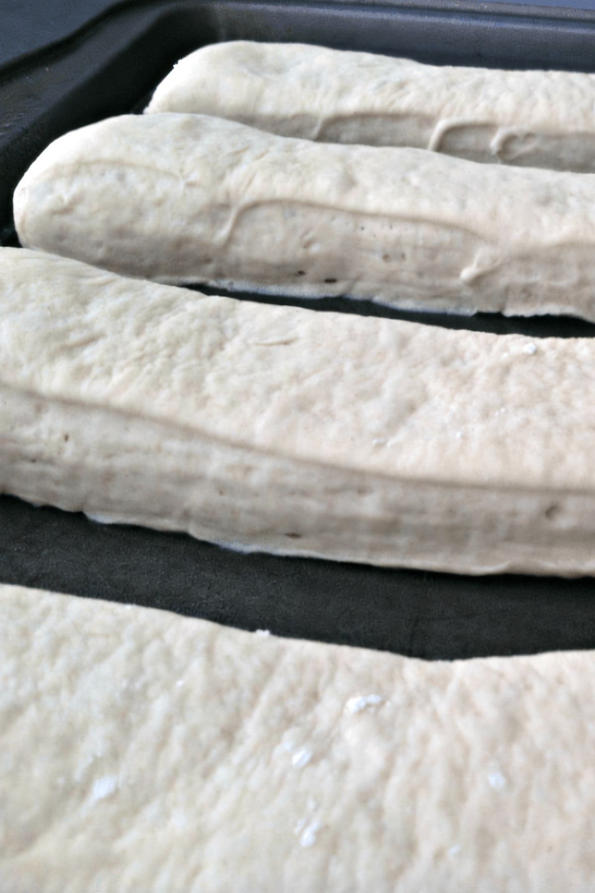 The breadsticks are formed and left for an hour to proof.