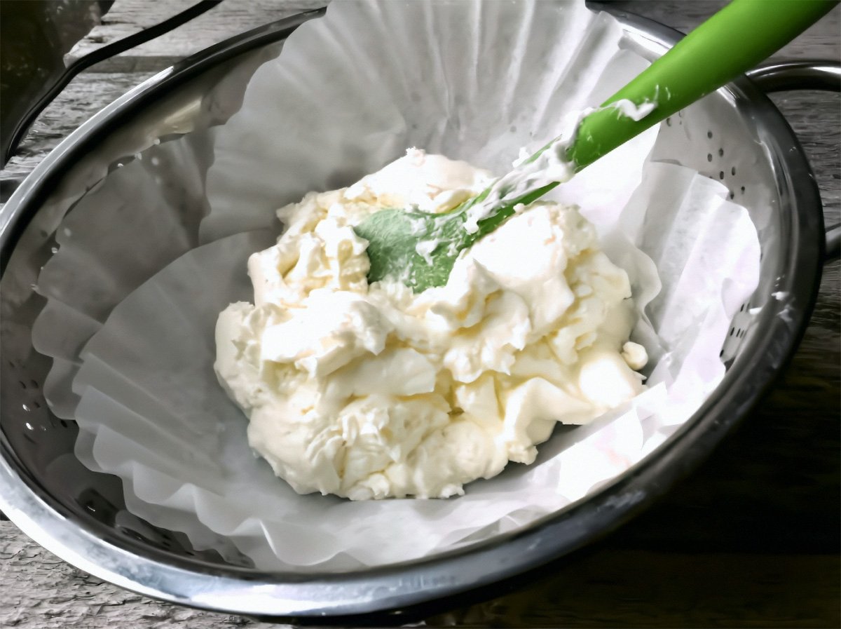 Straining the butter using cheesecloth.