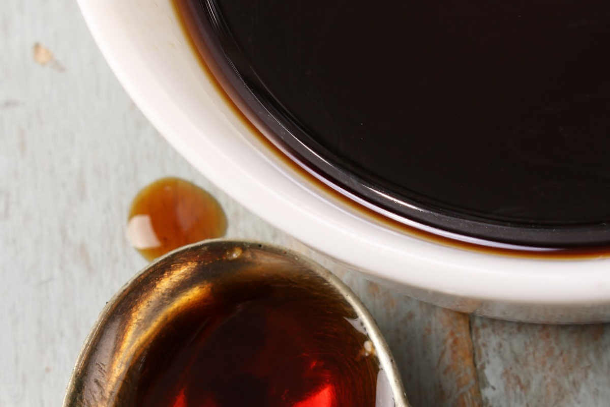 Worcestershire sauce in a bowl and spoon.