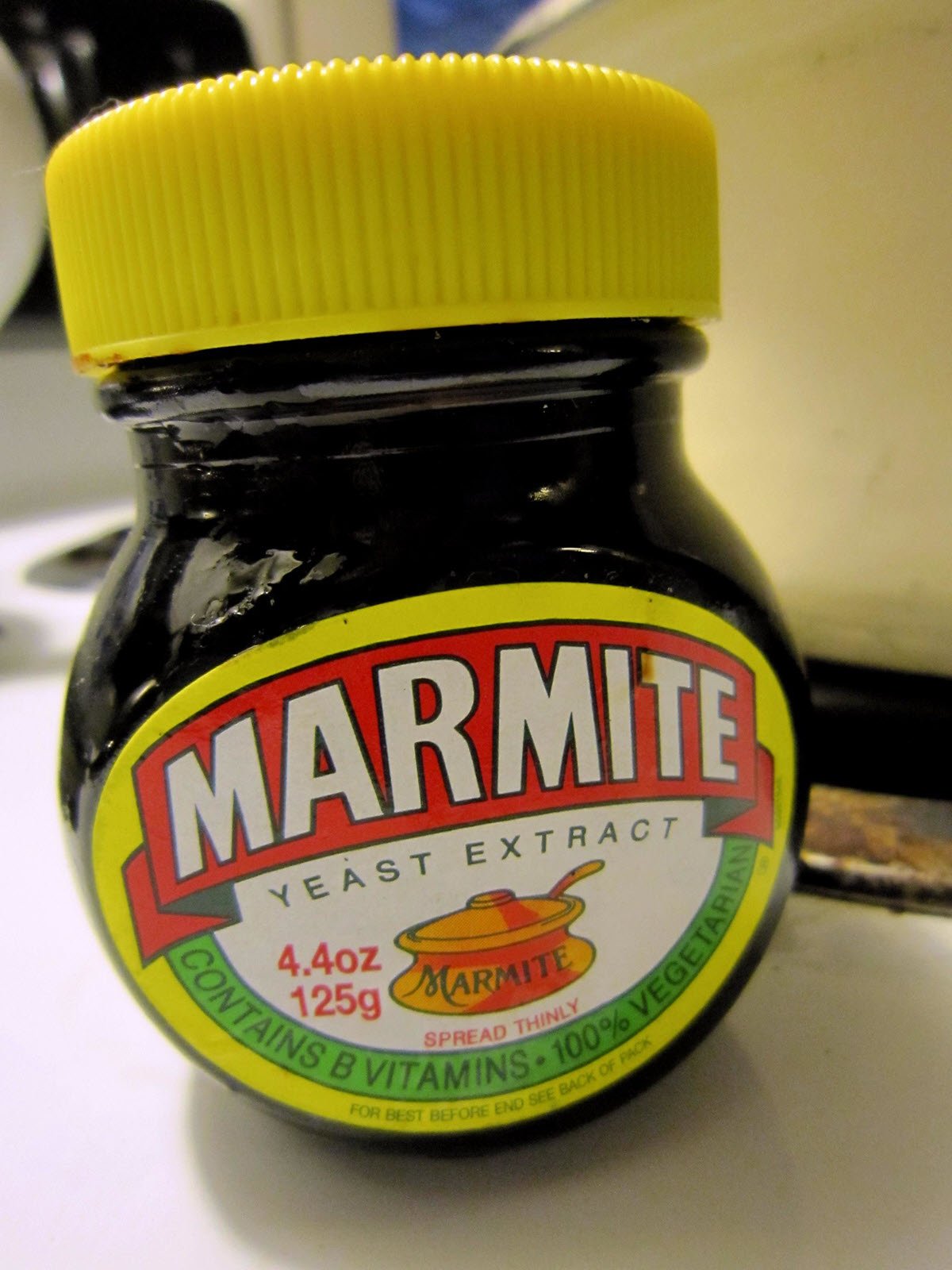 Jar of Marmite sauce on kitchen counter.