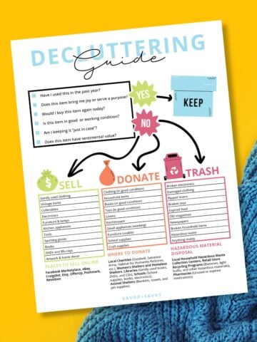 Free printable decluttering guide on yellow background with blue sweater.