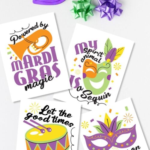 Flat lay with free printable Mardi Gras signs next to beads and masks.