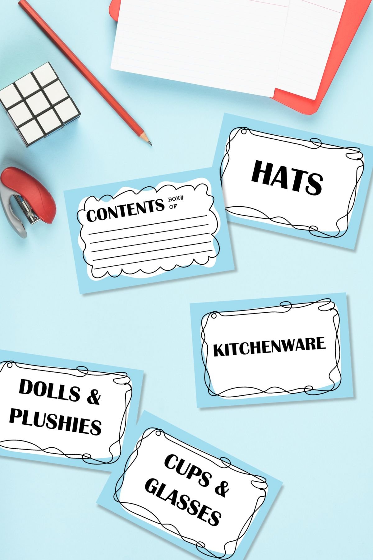 Large editable storage bin labels next to stapler and stationery.