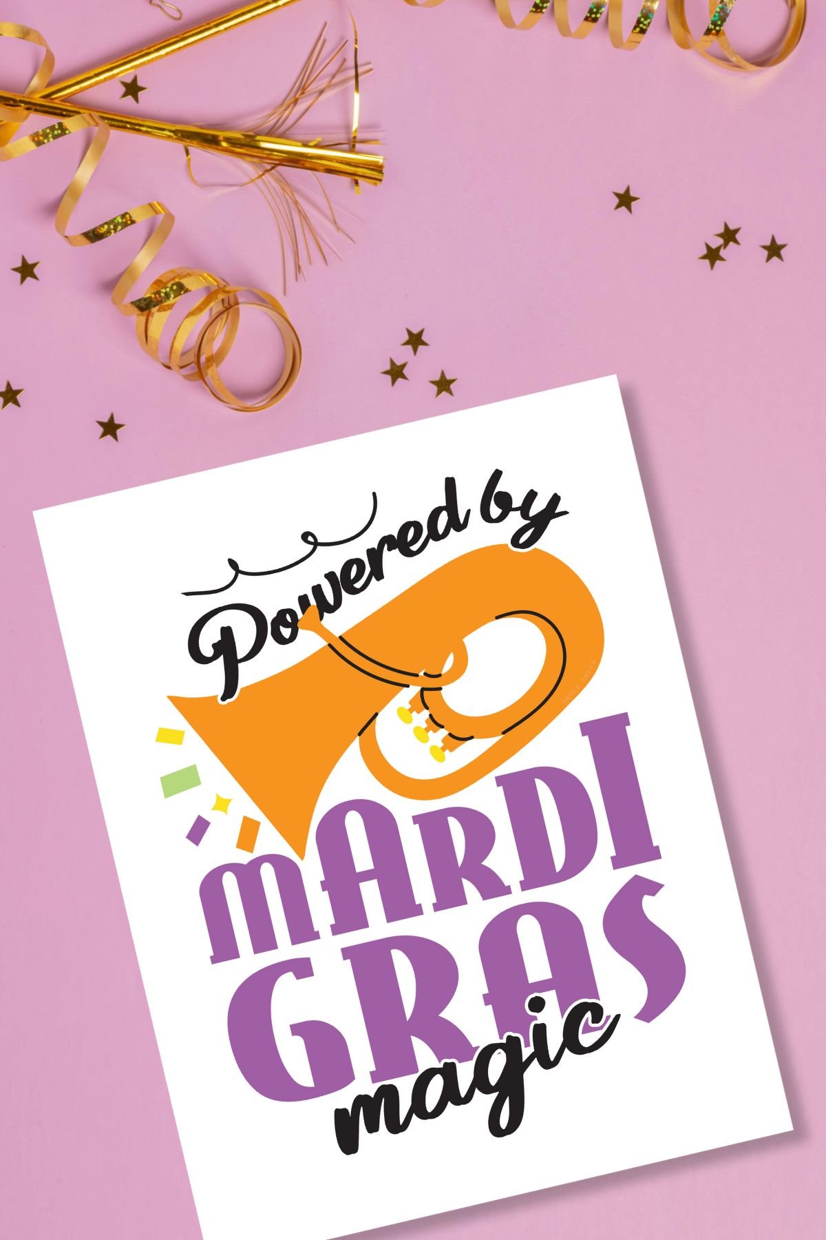 'Powered by Mardi Gras magic' free printable sign on a pink background.