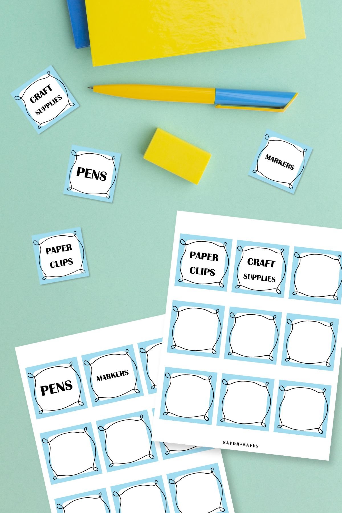 Free printable small storage bin labels on light green background next to pen and notebook.
