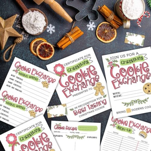 Free Christmas cookie exchange printables on a black table next to baking supplies and Christmas decor.