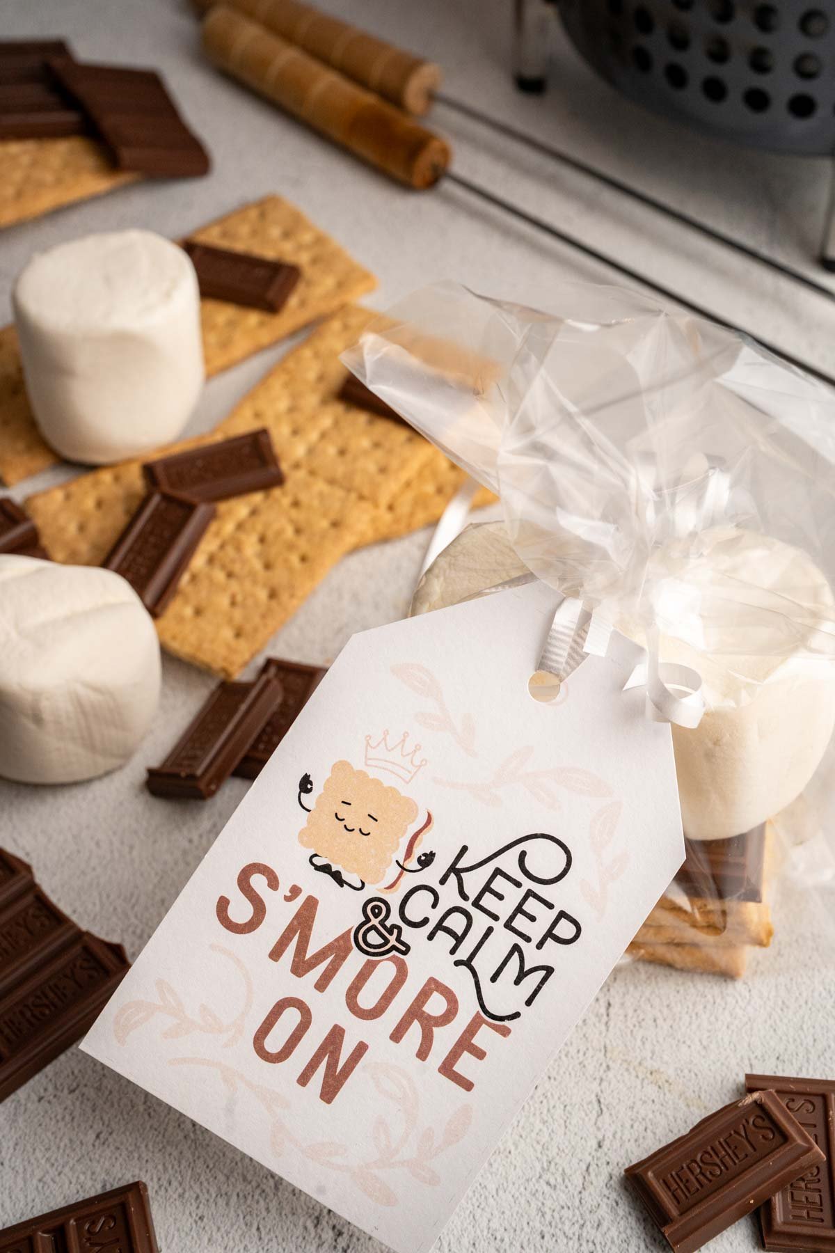 "Keep calm & S'more on" gift tag next to S'more gift ingredients.